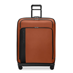Large expandable spinner suitcase by Briggs & Riley in canyon color, featuring durable wheels and spacious interior for travel.