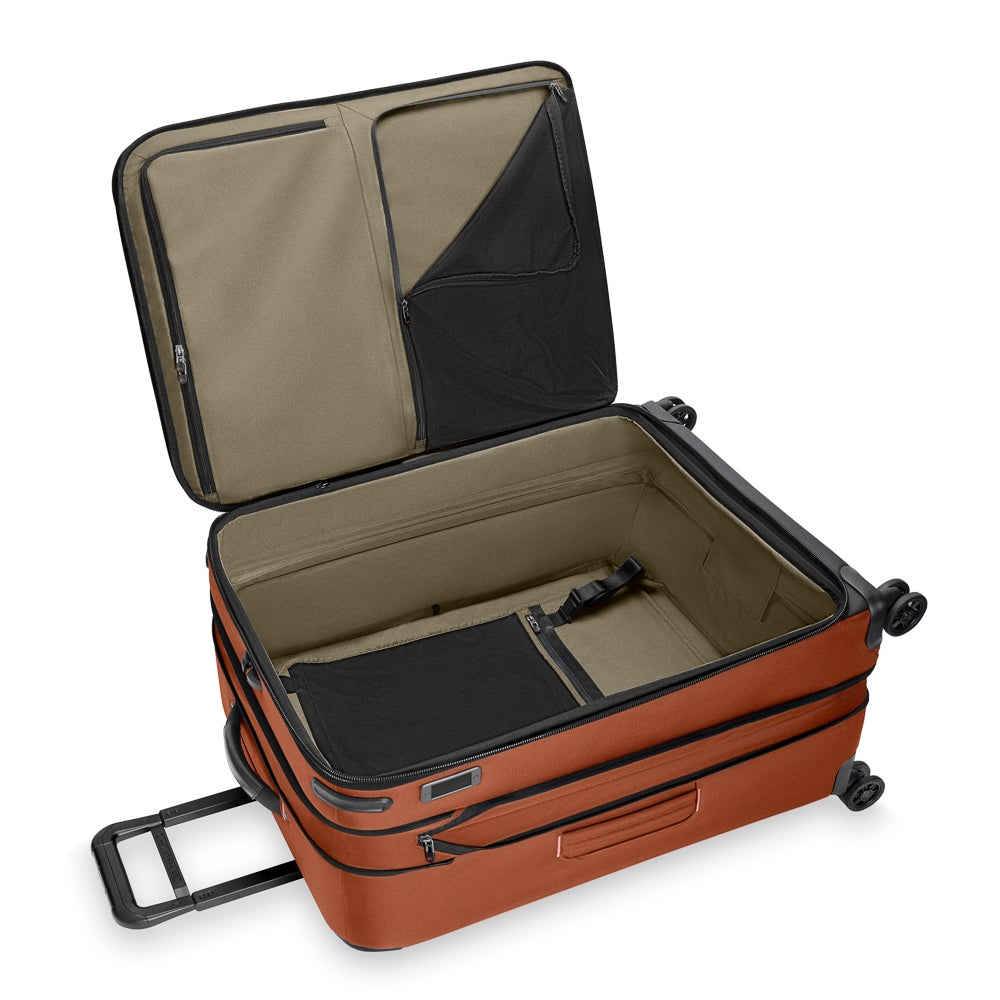 Briggs & Riley ZDX large expandable spinner suitcase in canyon color, showcasing durable design and spacious interior.