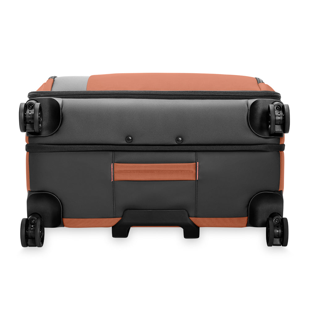 Briggs & Riley ZDX large expandable spinner suitcase in canyon color, showcasing a durable design and spacious interior.