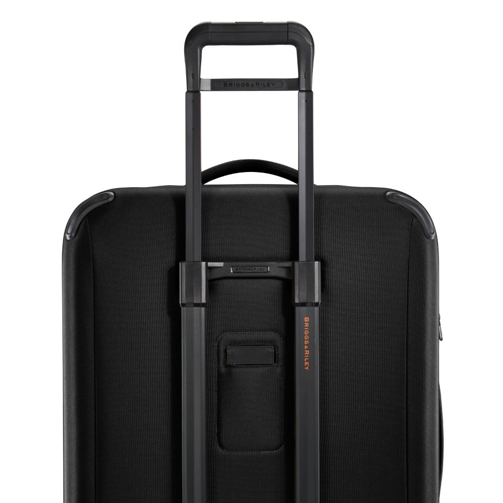 Briggs & Riley ZDX large spinner check-in luggage in black with smooth wheels and durable exterior.