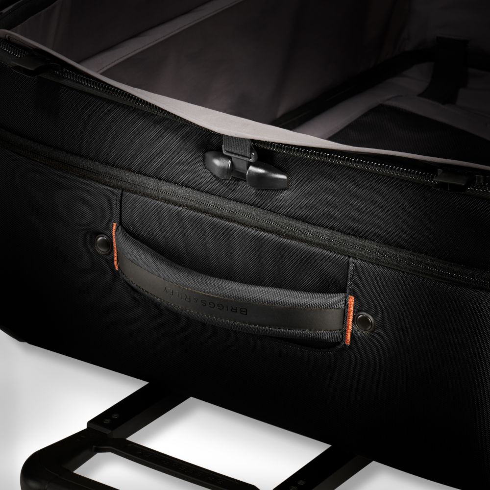 Briggs & Riley ZDX large spinner check-in luggage in black, showcasing durable wheels and spacious interior.