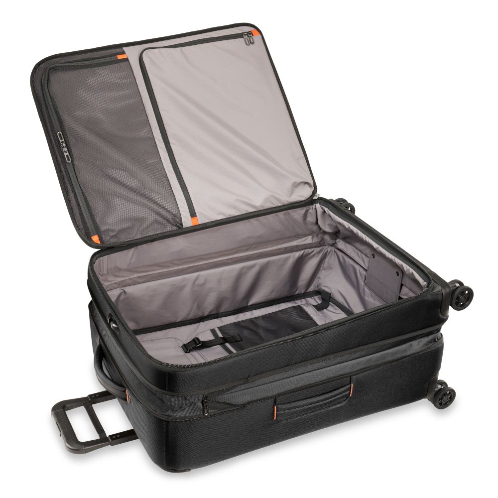 Briggs & Riley ZDX large spinner check-in luggage in sleek black with smooth wheels and durable exterior.