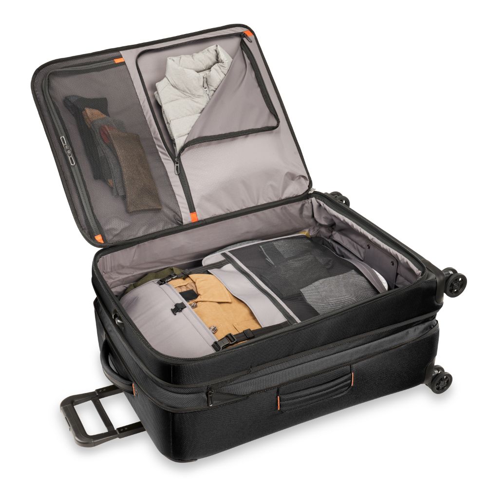 Briggs & Riley ZDX large spinner check-in luggage in black with smooth wheels and durable exterior.