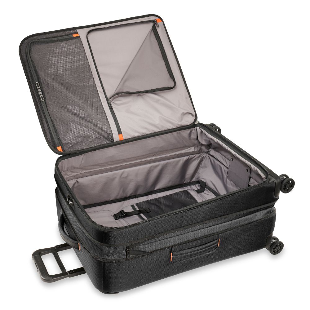 Large Briggs & Riley ZDX black check-in luggage with a durable spinner design and spacious interior.