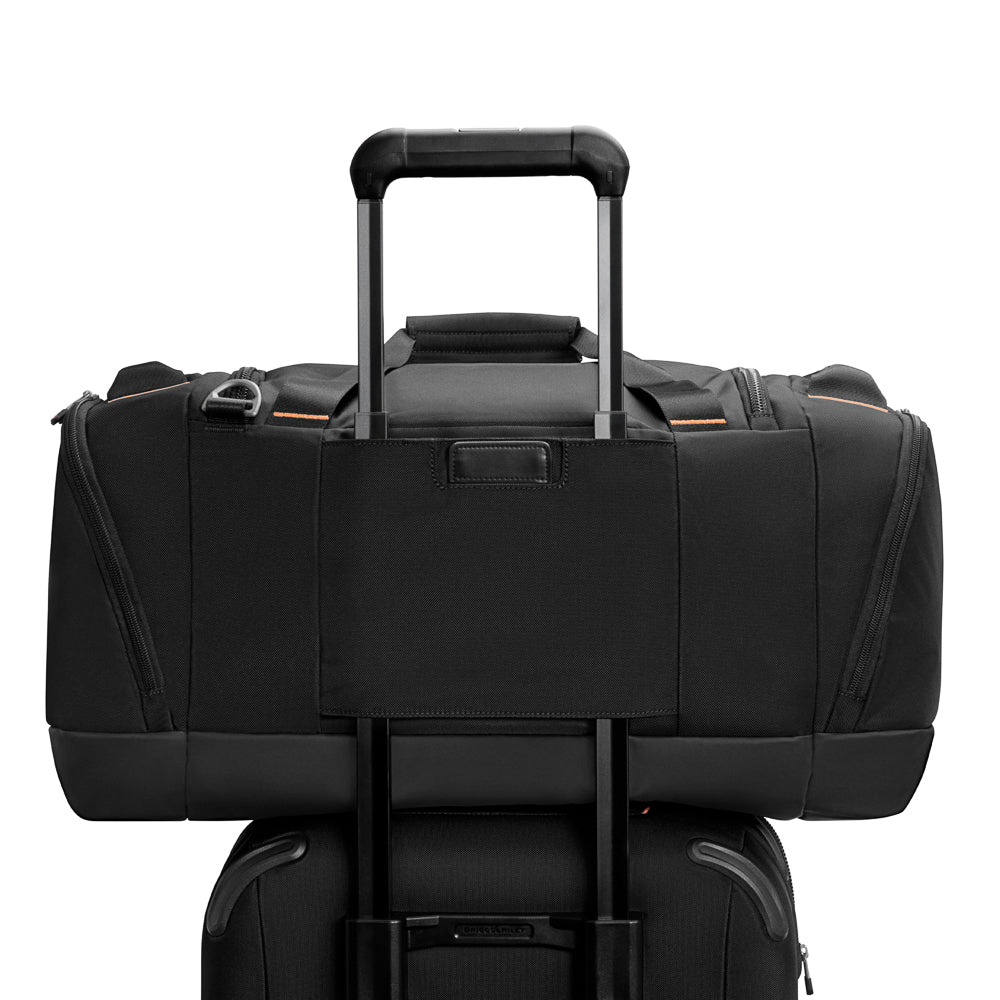 Large black travel duffle bag by Briggs & Riley, featuring durable material and spacious compartments for easy packing.