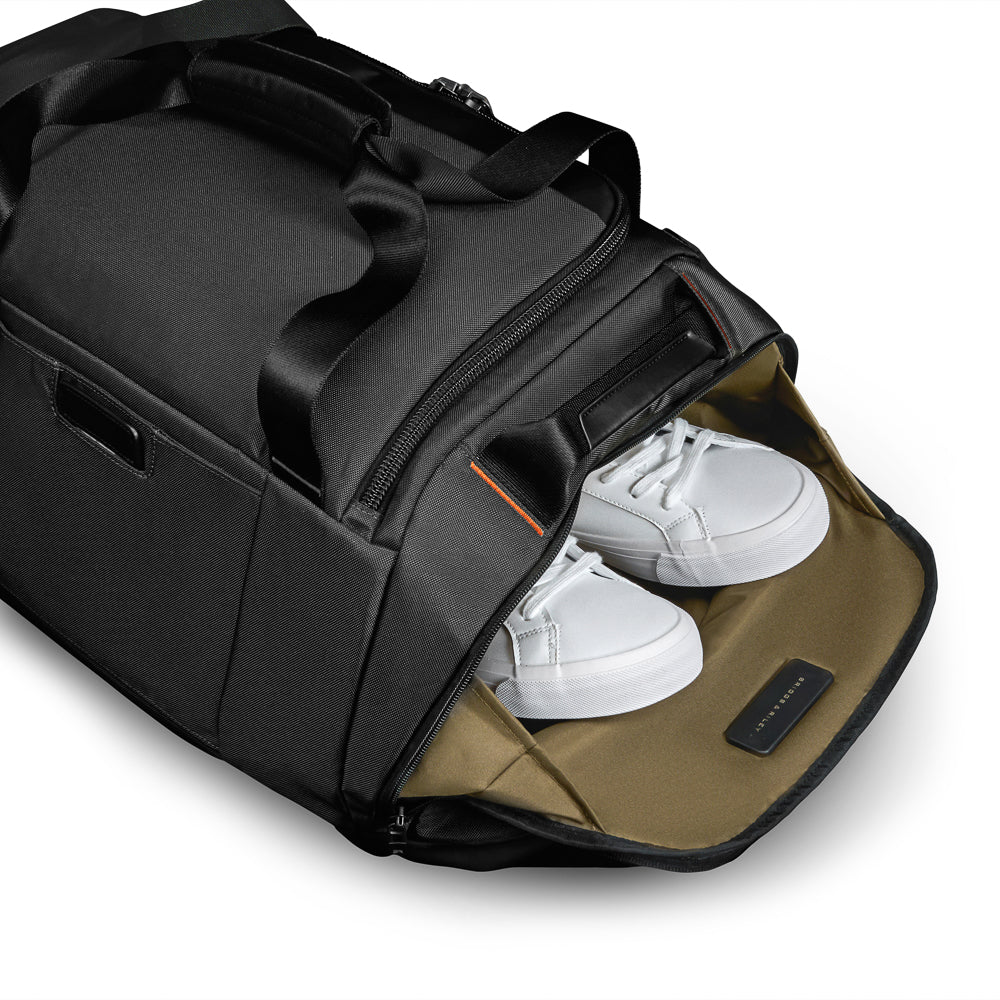Large black travel duffle from Briggs & Riley Luggage, featuring durable fabric and spacious design for easy packing.