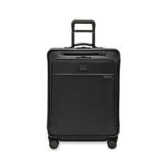Briggs & Riley Baseline 2 medium expandable spinner suitcase in black, showcasing its sleek design and durable wheels.