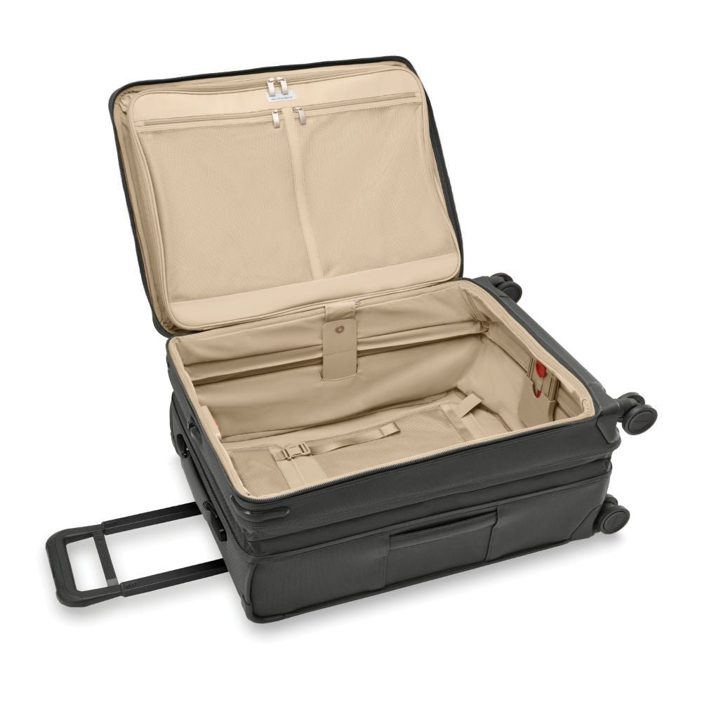 Briggs & Riley Baseline 2 medium expandable spinner suitcase in black with smooth wheels and sturdy handle.