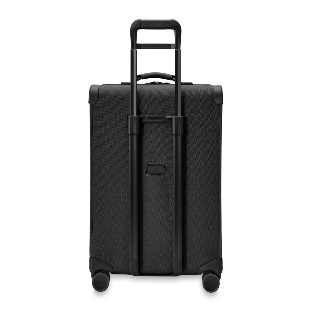 Briggs & Riley Baseline 2 medium expandable spinner suitcase in black, showcasing wheels and handle design.