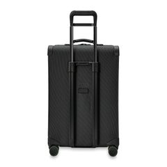 Briggs & Riley Baseline 2 medium expandable spinner suitcase in black, showcasing wheels and handle design.