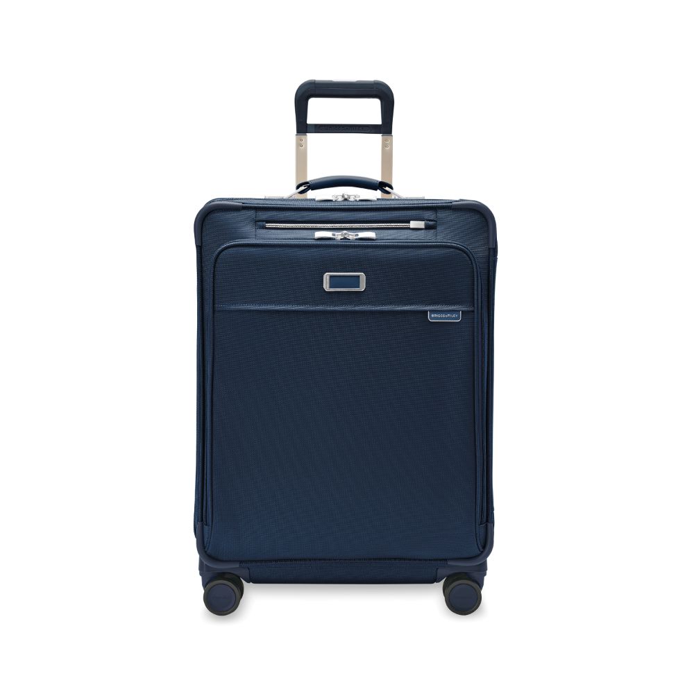 Navy medium expandable spinner suitcase from Briggs & Riley, showcasing a sleek design and durable exterior.