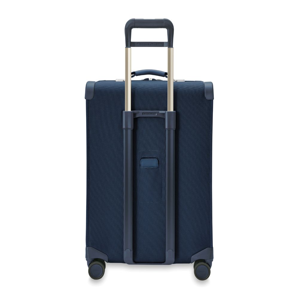 Briggs & Riley Baseline 2 medium expandable spinner suitcase in navy, featuring durable wheels and spacious interior.