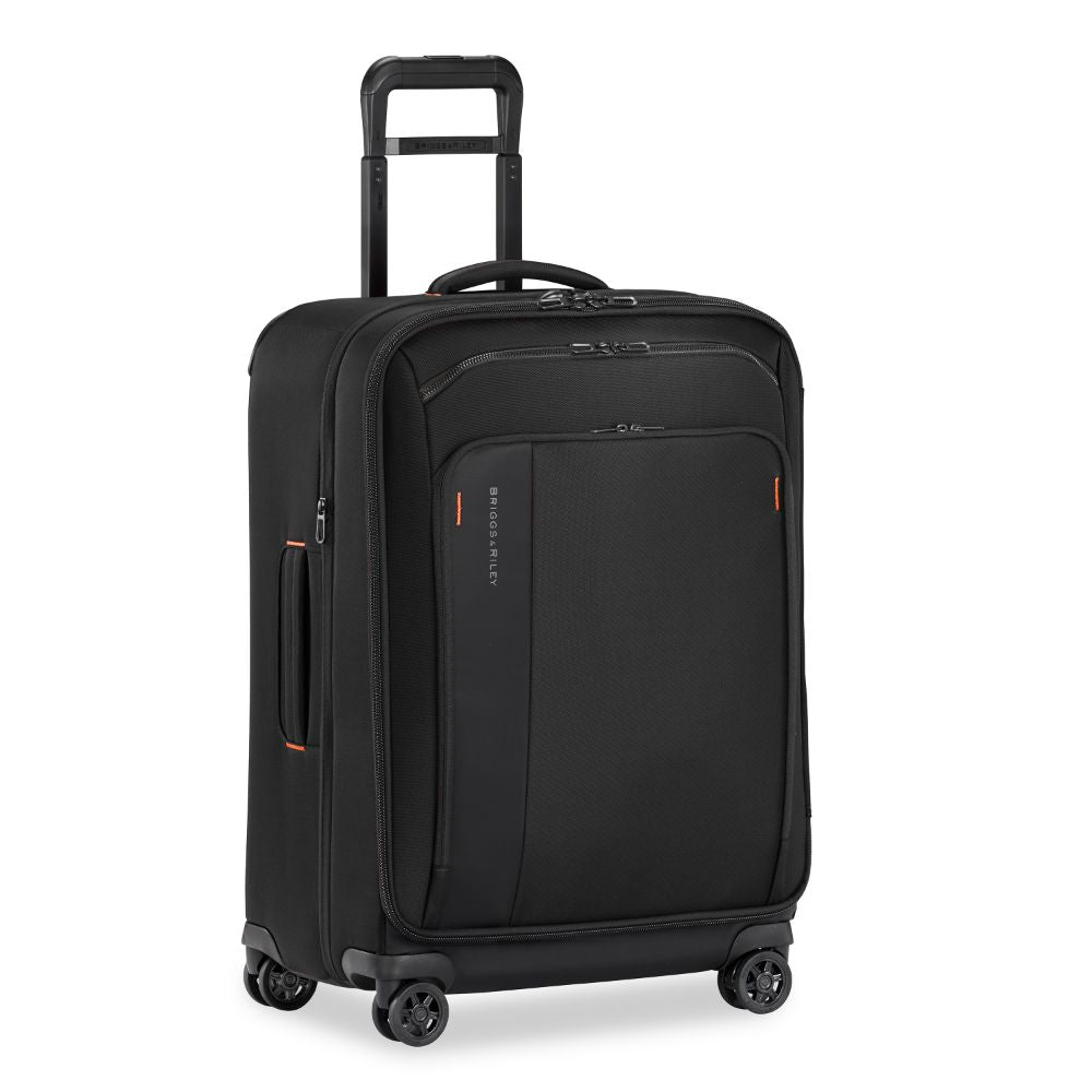 Briggs & Riley ZDX medium spinner check-in luggage in black with smooth wheels and durable exterior.