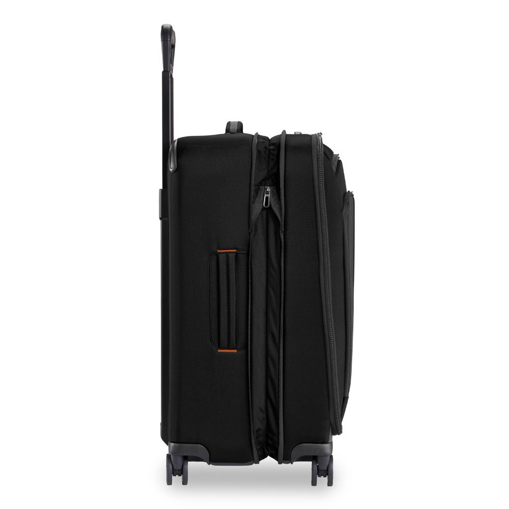 Briggs & Riley ZDX medium spinner check-in luggage in black with four wheels and a sleek design.