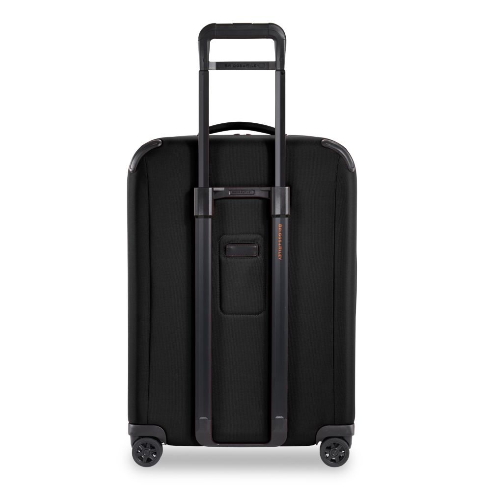 Briggs & Riley ZDX Medium Spinner check-in luggage in sleek black with smooth wheels and sturdy handle.