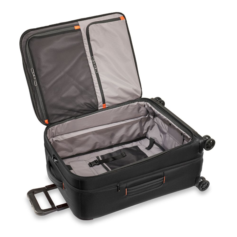 Briggs & Riley ZDX medium spinner check-in luggage in black with smooth wheels and sturdy handle for easy travel.