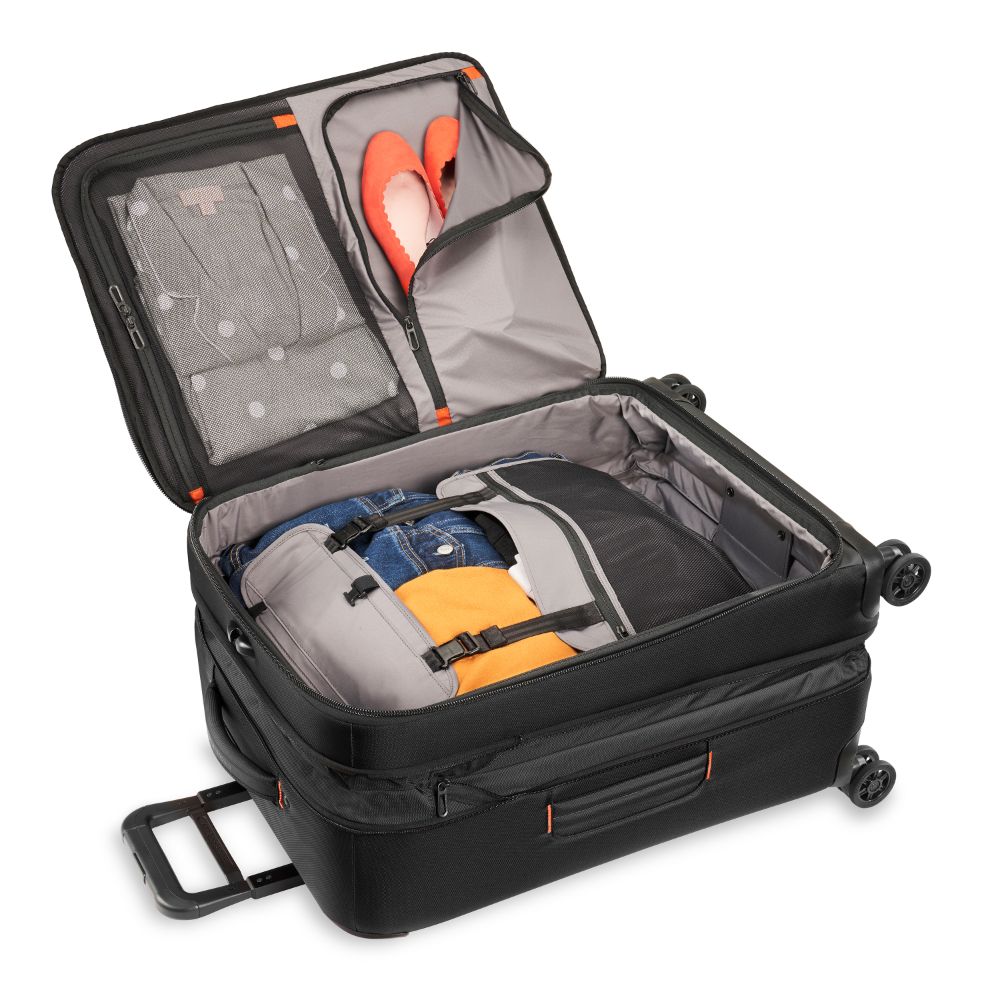 Briggs & Riley ZDX medium spinner check-in luggage in sleek black with smooth wheels and a durable design.