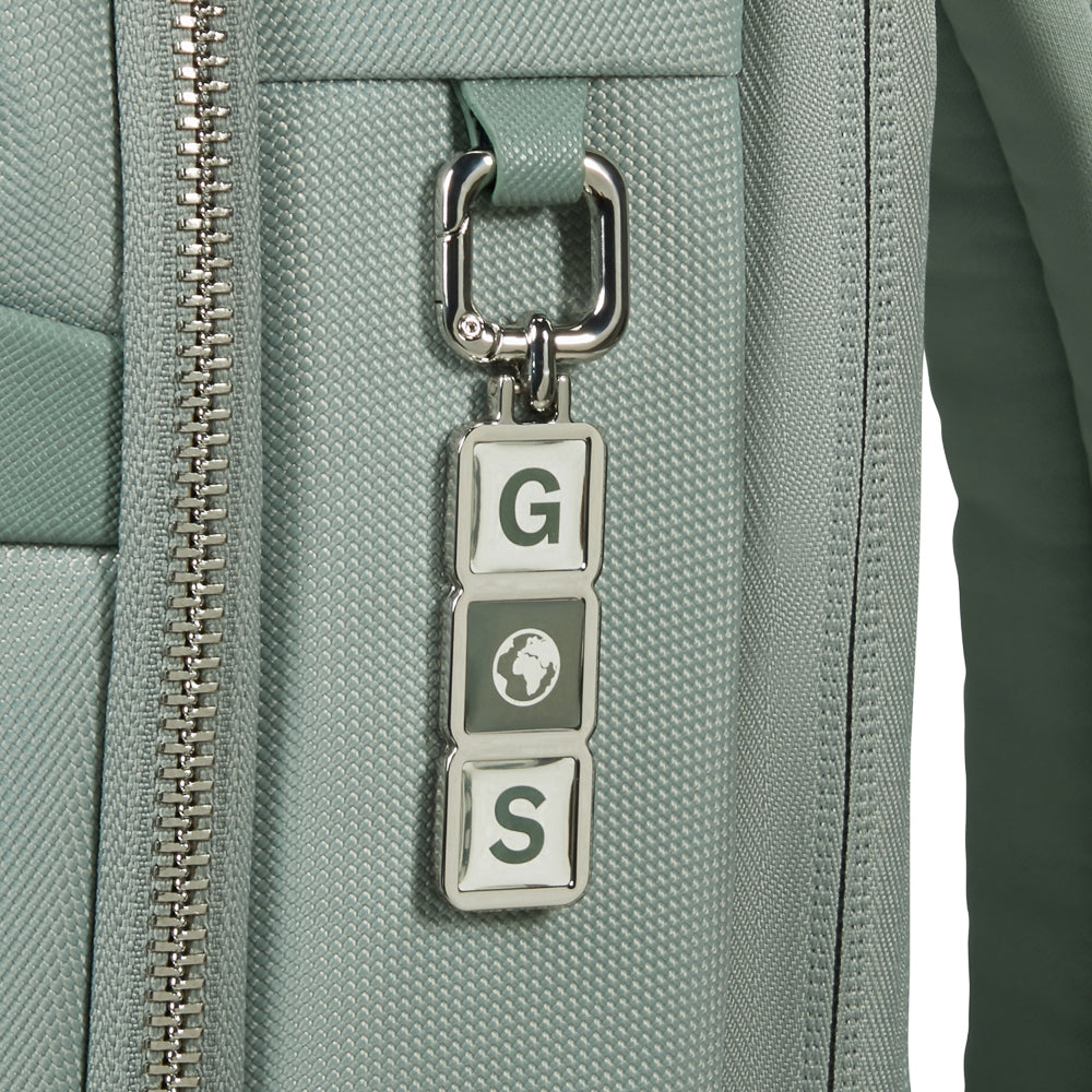 Samsonite 15.6" laptop backpack in thyme color with padded compartments and adjustable straps displayed on a flat surface.