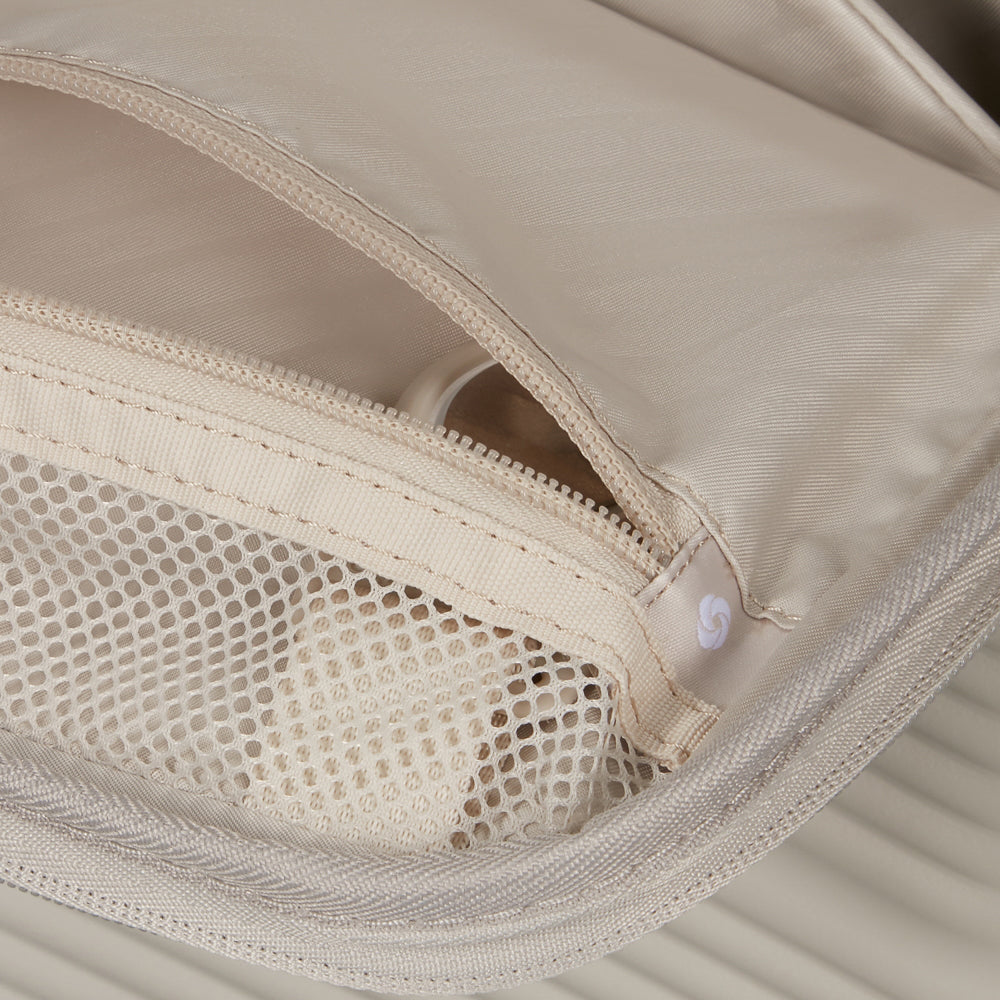 White 55cm cabin suitcase with front pocket by Samsonite, showcasing its sleek design and durable construction.
