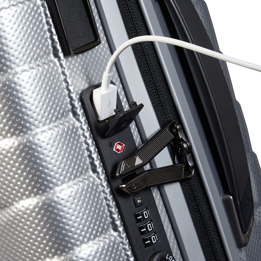 Silver 55cm expandable cabin spinner suitcase by Samsonite, featuring four wheels and a sleek design.