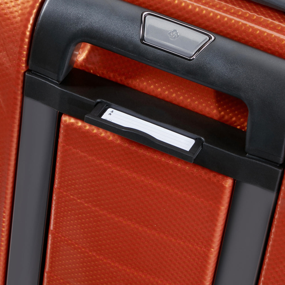 55cm Samsonite Proxis expandable cabin spinner suitcase in vibrant flame color, showcasing wheels and handle design.