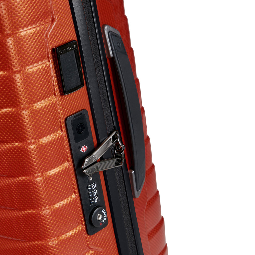 55cm Samsonite Proxis expandable cabin spinner suitcase in vibrant flame color with smooth wheels and sturdy handle.