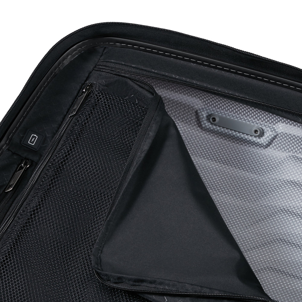 55cm expandable cabin spinner suitcase by Samsonite in flame color with smooth wheels and sturdy handle.