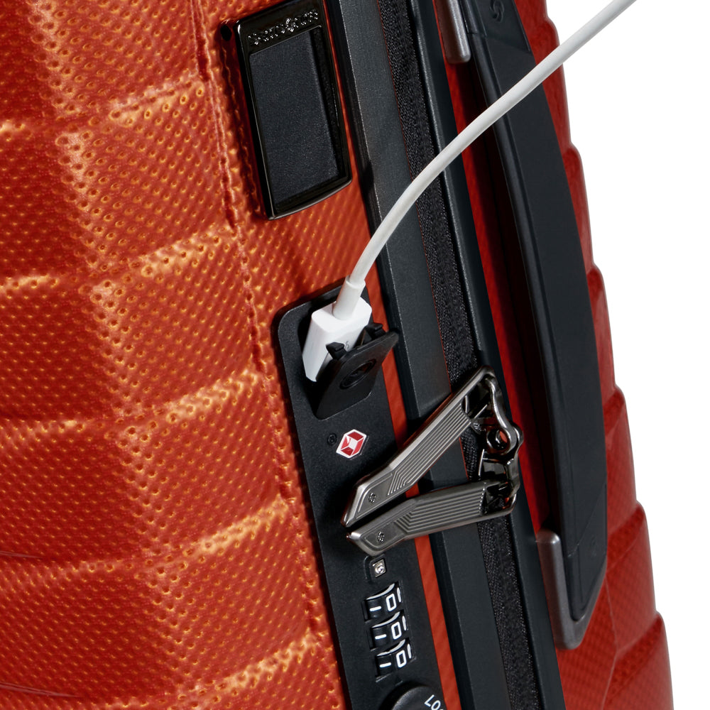 55cm Samsonite Proxis expandable cabin spinner suitcase in vibrant flame color, showcasing smooth wheels and sturdy handle.