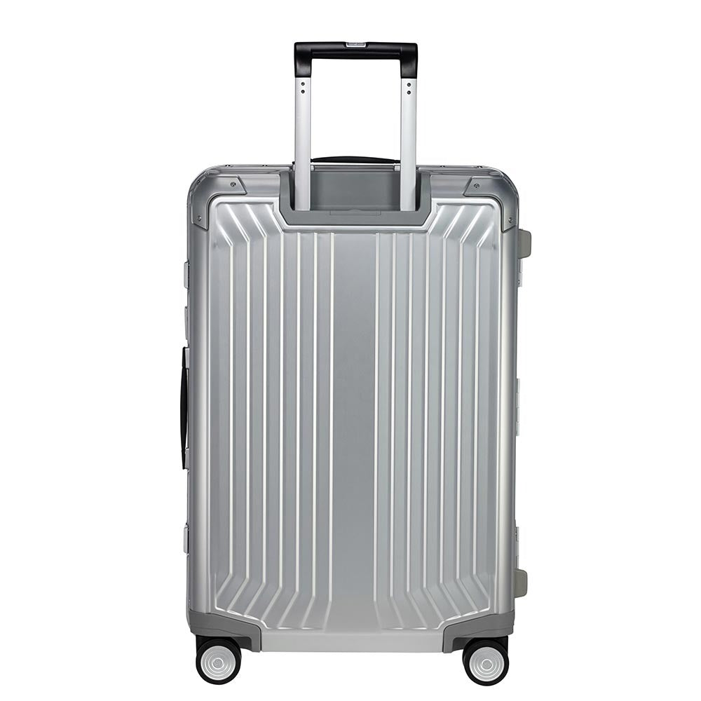 Samsonite Lite-Box Aluminium 69cm spinner suitcase in silver with four wheels and a sleek design.