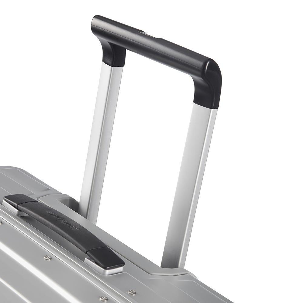 Samsonite Lite-Box Aluminium 69cm spinner suitcase in sleek design with smooth wheels and sturdy handle.