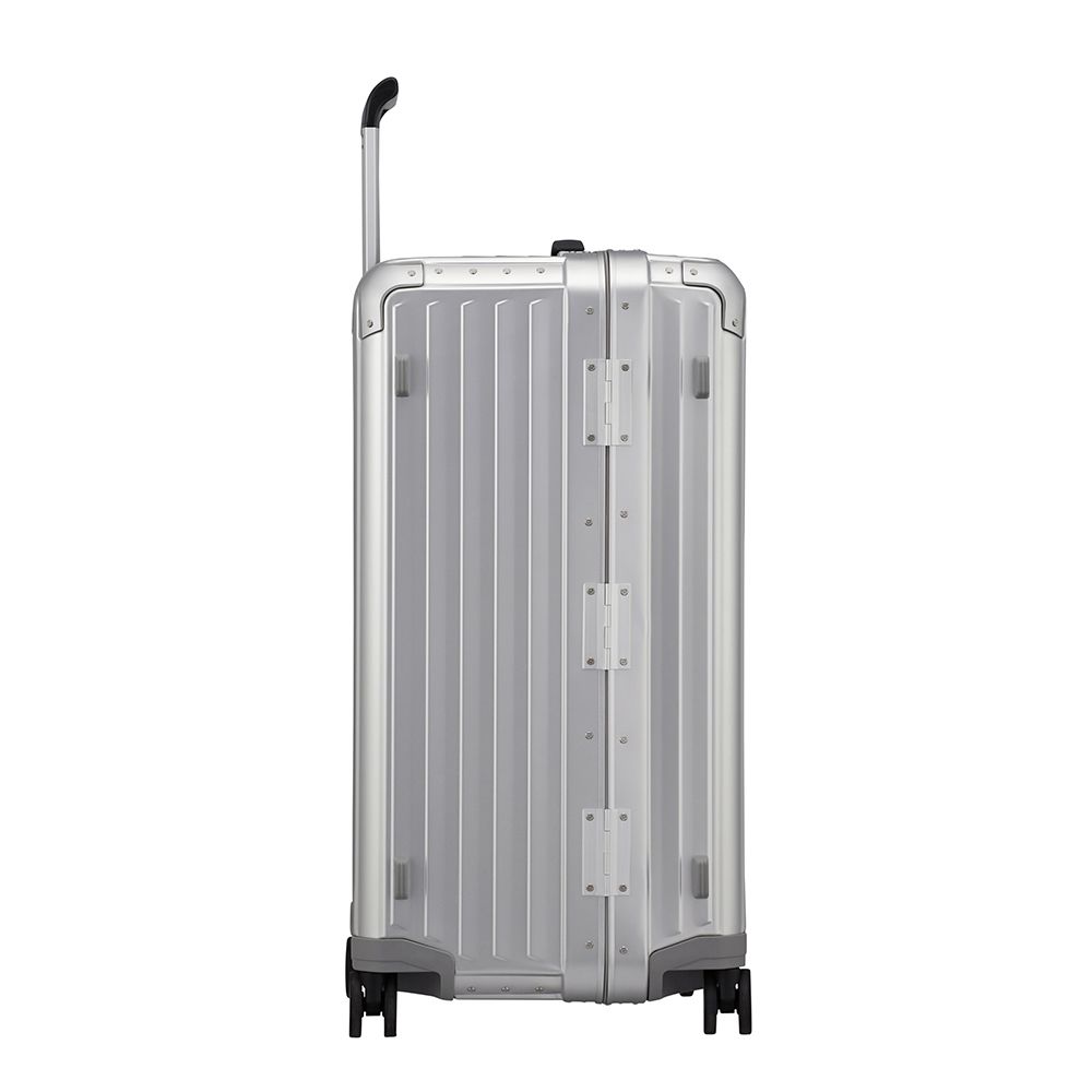 Samsonite Litebox 74cm trunk suitcase in aluminum, showcasing a sleek design with durable wheels and a spacious interior.