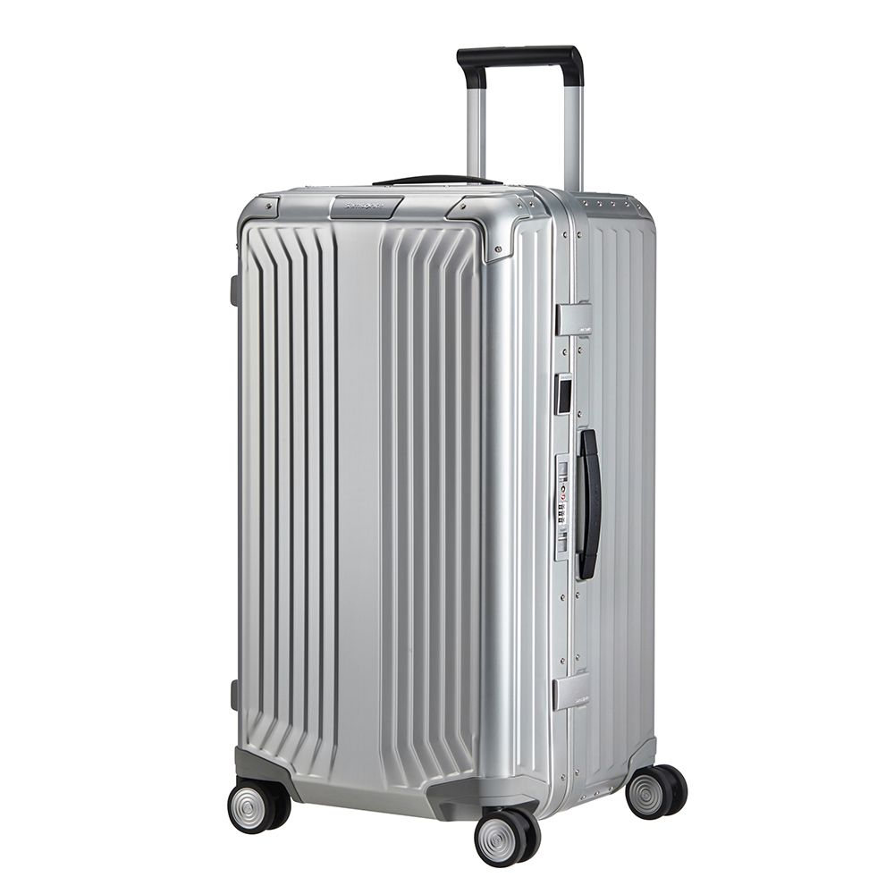 Samsonite Litebox Aluminium 74cm trunk suitcase in silver, featuring a sleek design and sturdy wheels for easy travel.