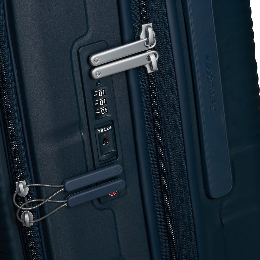 Navy 75cm expandable spinner suitcase by Samsonite, featuring smooth wheels and sturdy handles for easy travel.
