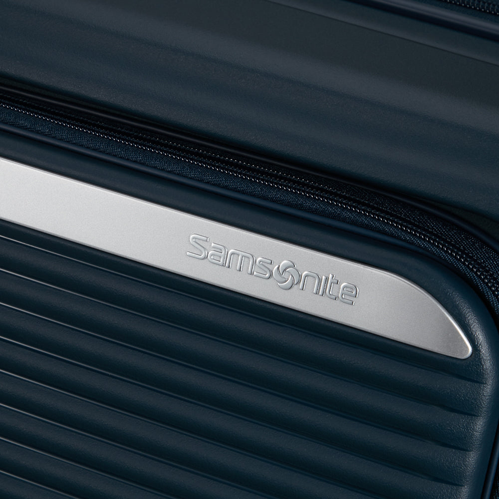 Navy 75cm expandable spinner suitcase by Samsonite, featuring smooth wheels and a spacious interior for travel.