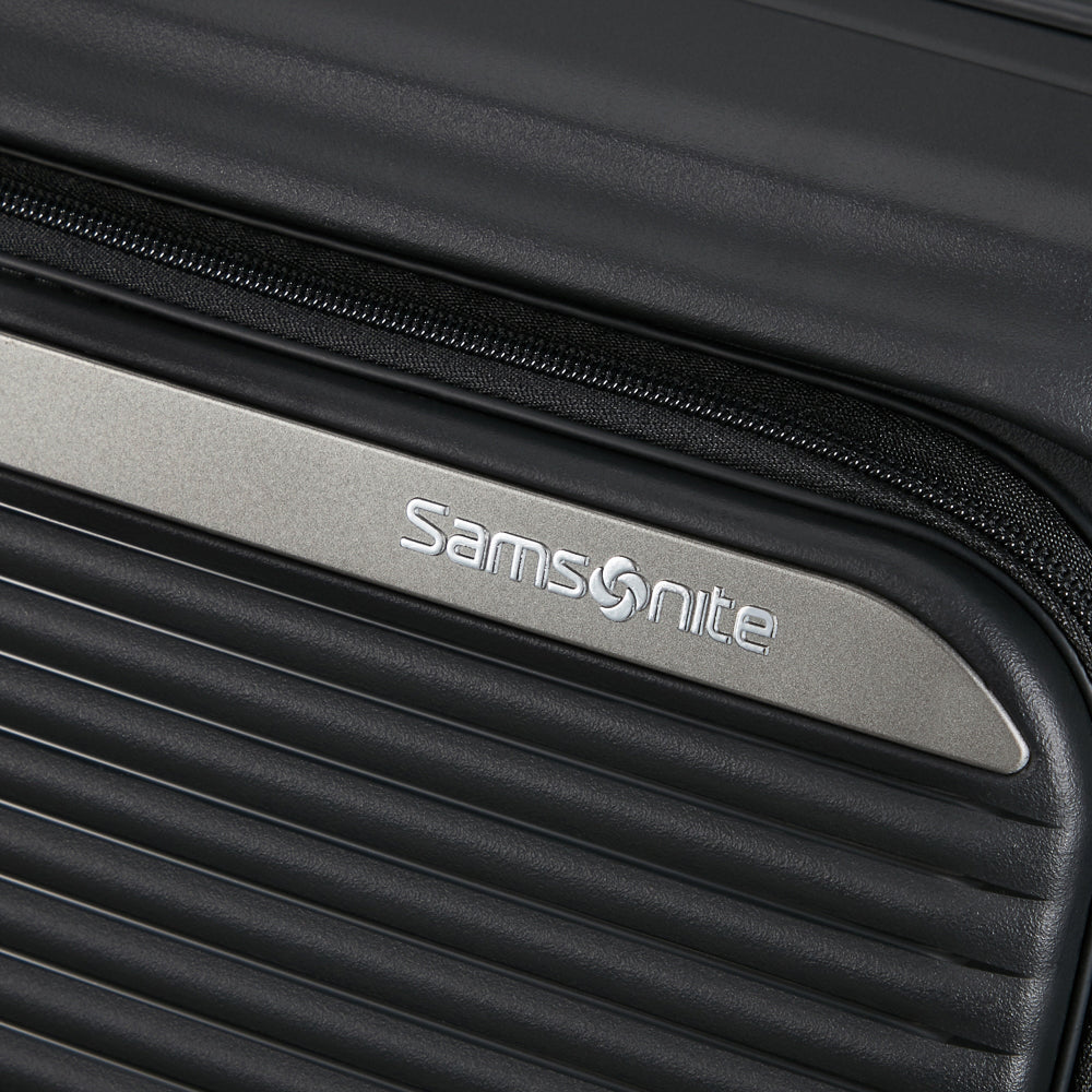 Black 75cm expandable spinner suitcase by Samsonite, featuring smooth wheels and a durable exterior for travel convenience.