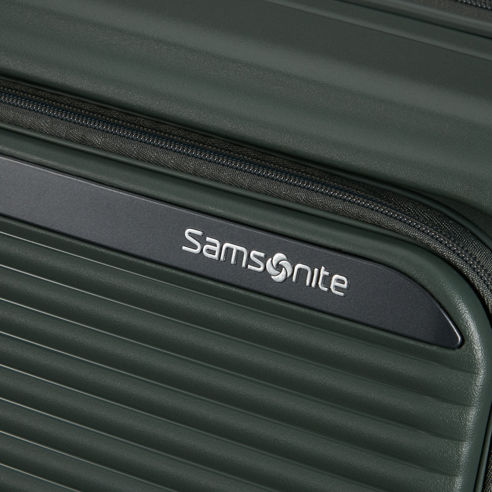 Olive 75cm expandable spinner suitcase by Samsonite, featuring four wheels and a spacious interior for travel convenience.