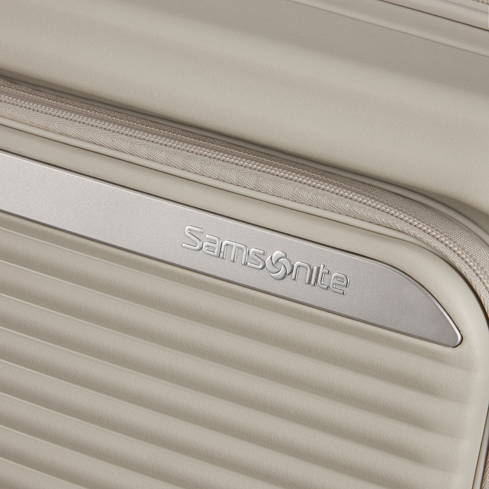 Samsonite Paralux 75cm expandable spinner suitcase in white, featuring smooth wheels and sturdy handle for easy travel.