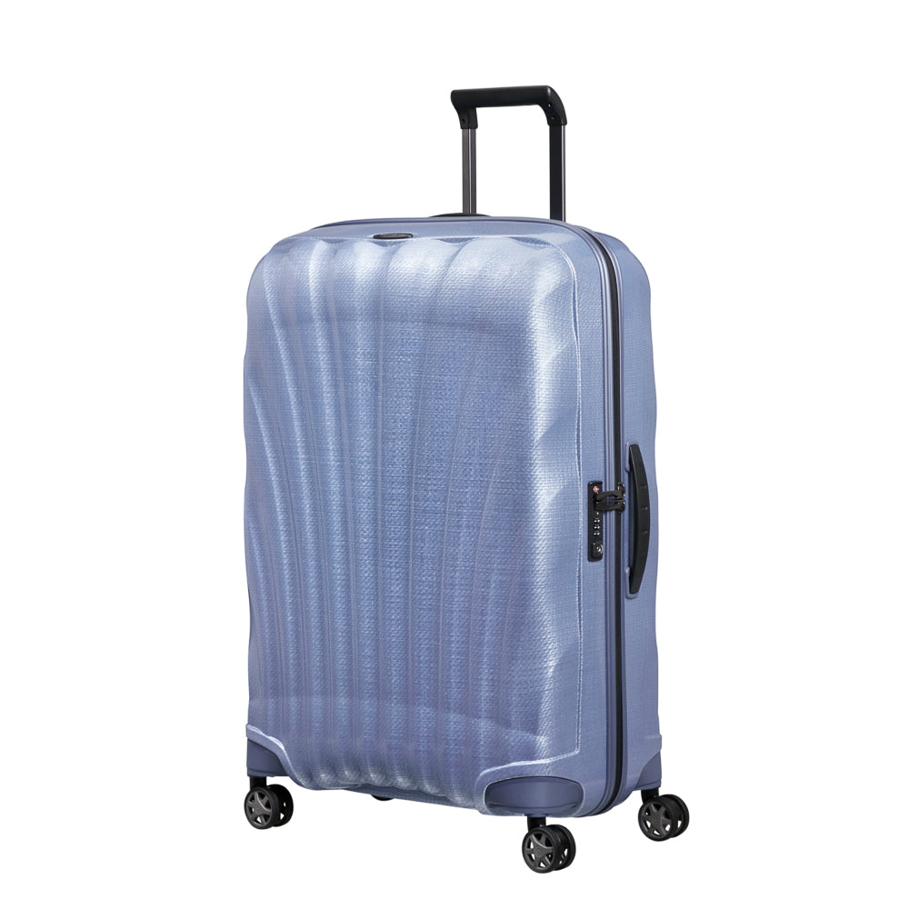 Lavender Samsonite C-Lite 75cm spinner suitcase with four wheels and a sturdy handle for easy travel.