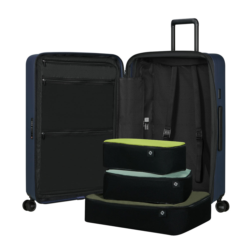 75cm Samsonite Restackd spinner suitcase in midnight blue with smooth wheels and spacious interior for travel convenience.