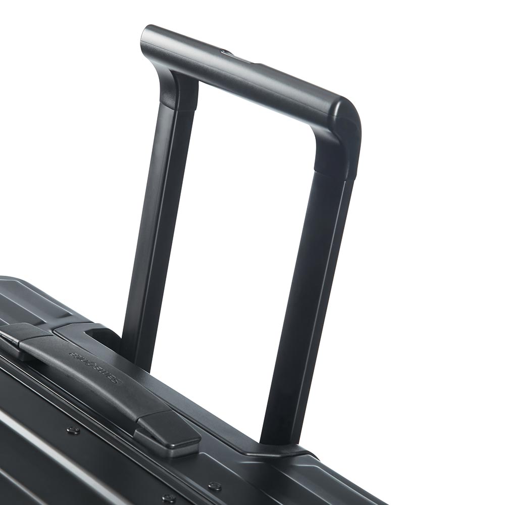 Black 76cm Samsonite Lite-Box Aluminium spinner suitcase with four wheels and a sleek design.