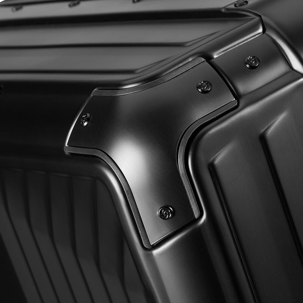 Black 76cm Samsonite Lite-Box Aluminium spinner suitcase with four wheels and a sleek design.