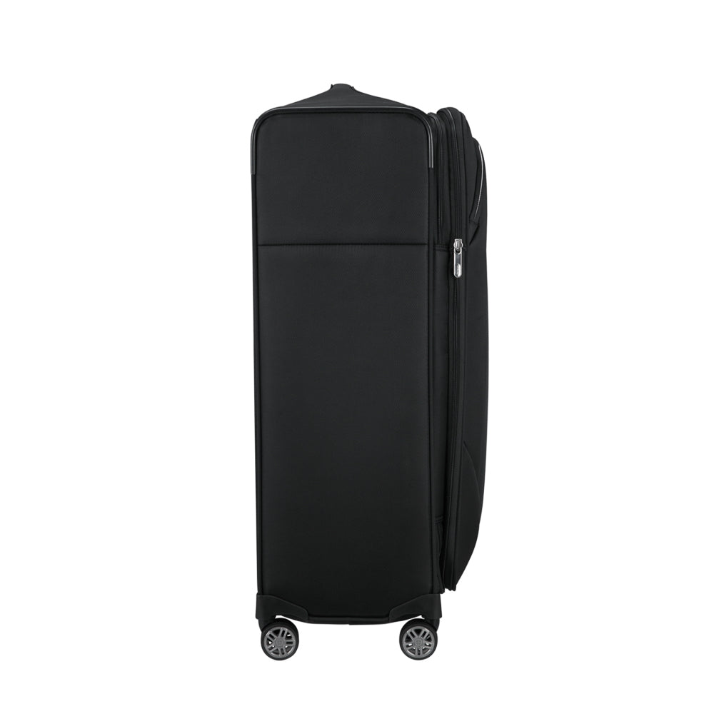 Black 78cm Samsonite Re-Lite expandable spinner suitcase with smooth wheels and sturdy handle.