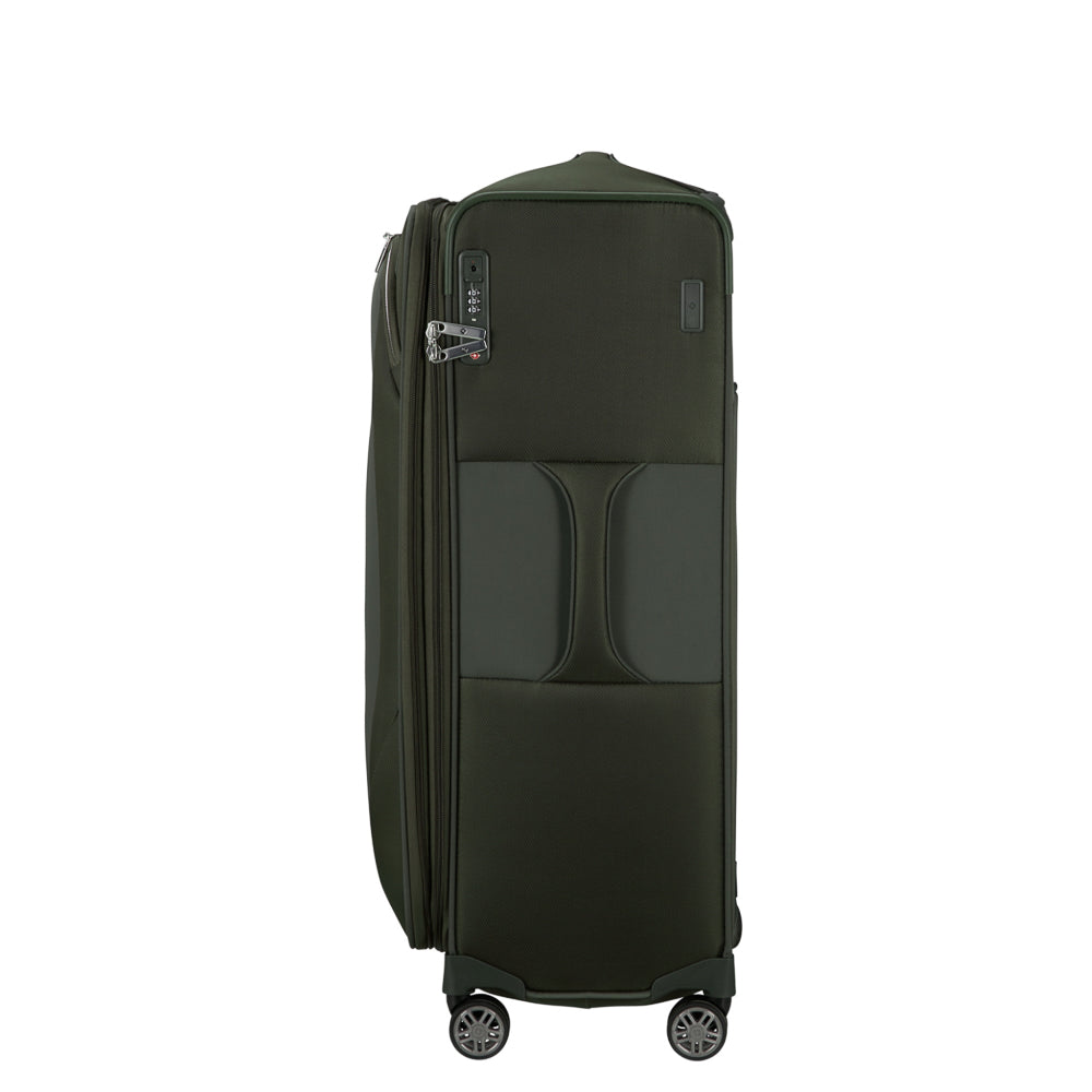 Green Samsonite Re-Lite 78cm expandable spinner suitcase with smooth wheels and sturdy handle for check-in travel.