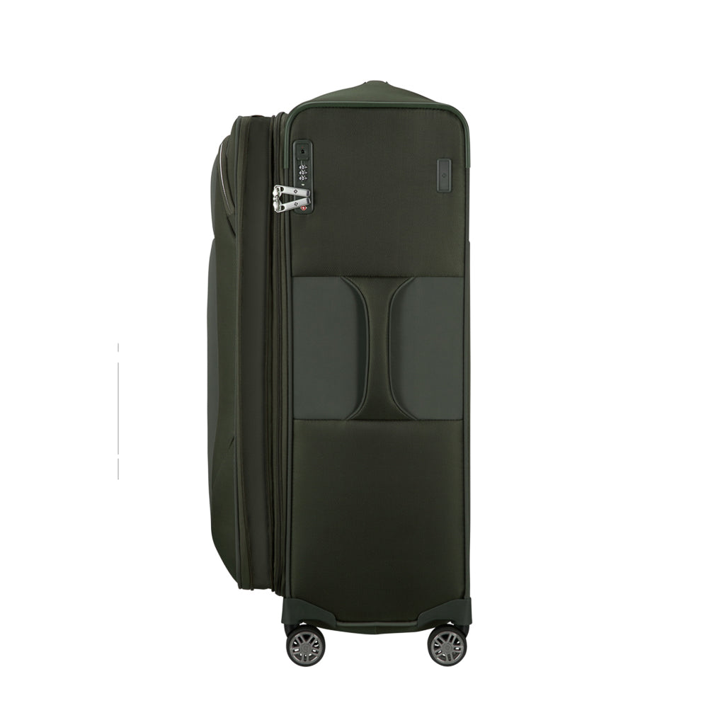 Green 78cm expandable spinner suitcase from Samsonite, featuring four wheels and a spacious interior for check-in luggage.