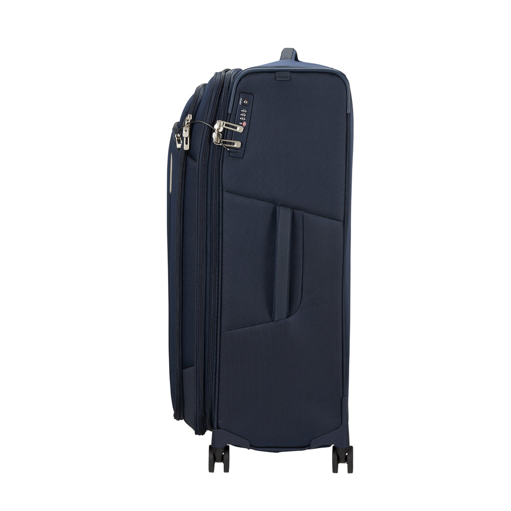 Midnight blue 79cm spinner suitcase from Samsonite Luggage, featuring smooth wheels and sturdy handle for easy travel.