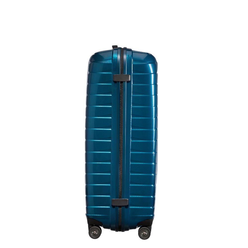 Petrol blue Samsonite Proxis 81cm spinner suitcase with four wheels and a sleek design, ideal for check-in luggage.