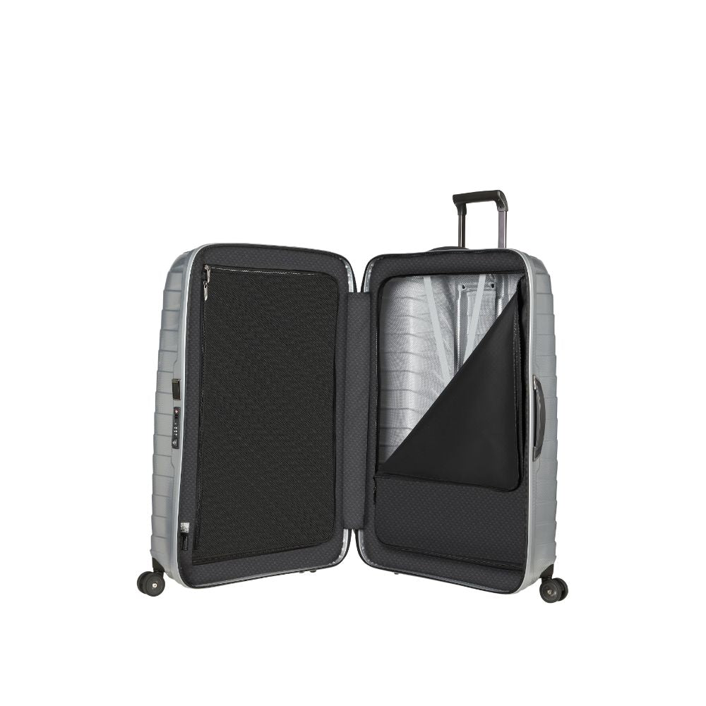 Silver Samsonite Proxis 81cm spinner suitcase with smooth wheels and durable exterior, perfect for check-in luggage.