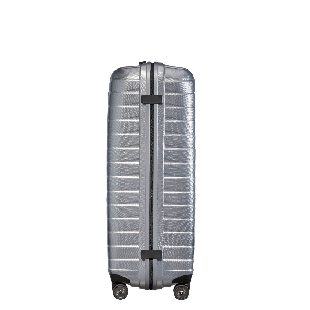 Silver Samsonite Proxis 81cm spinner suitcase with smooth wheels and durable exterior, perfect for check-in luggage.