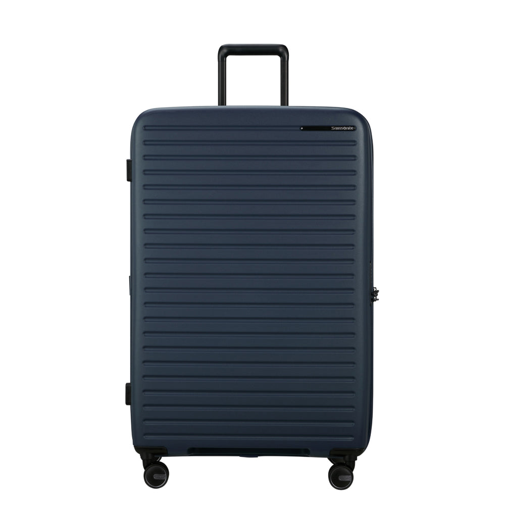 81cm Restackd Spinner Suitcase by Samsonite in midnight blue, showcasing wheels and expandable design for travel convenience.