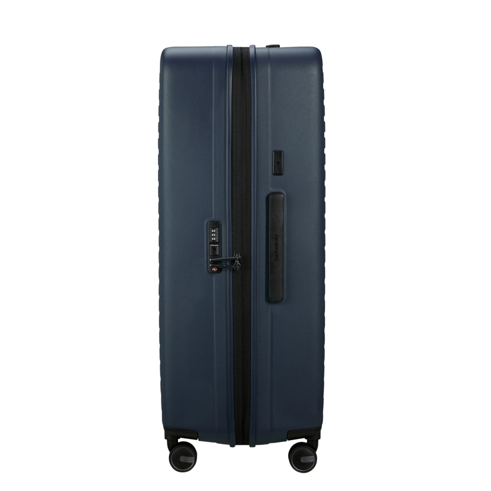 81cm Restackd Spinner Suitcase by Samsonite in midnight blue, showcasing wheels and expandable design for travel convenience.
